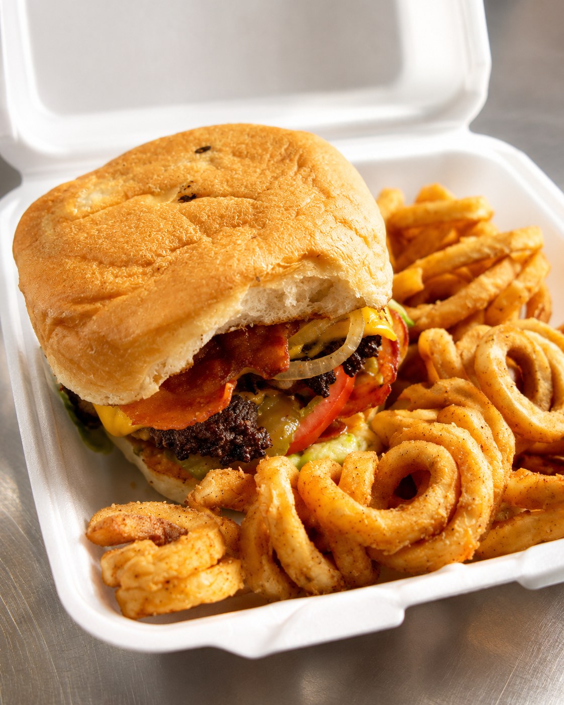 JJ's bacon cheeseburger with curly fries